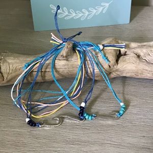 Adjustable string bracelet set.